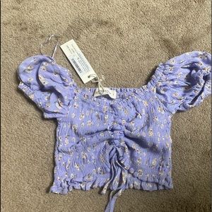 purple flowered shirt